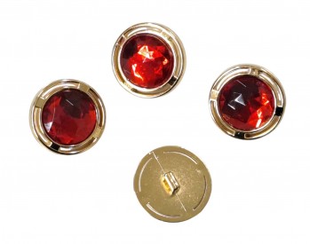 Diamant knoop. Rond op een steeltje  Een rood/gouden knoop van kunststof.  Doorsnee ongeveer 22 mm.